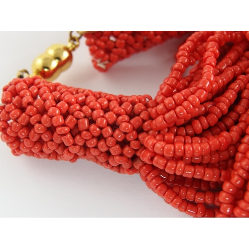 689 - A carved coral cameo necklace