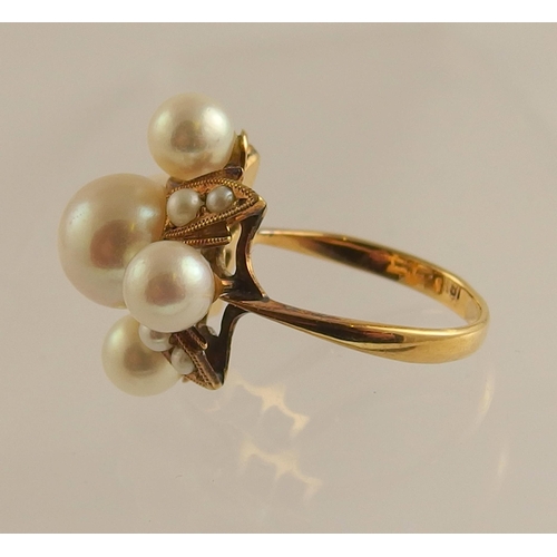 690 - An 18ct gold pearl dress ring