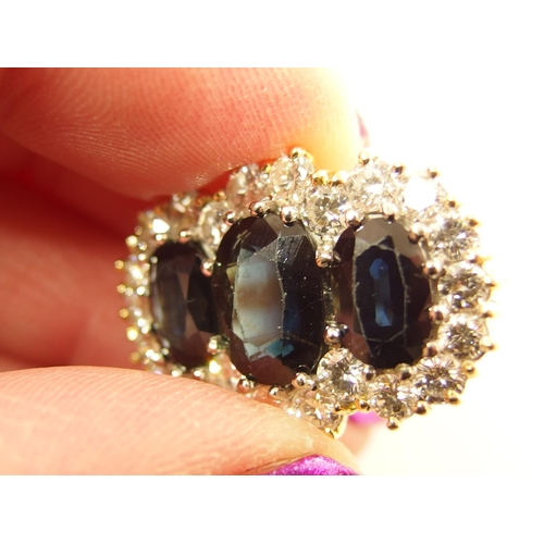 691 - An 18ct substantial sapphire and diamond ring