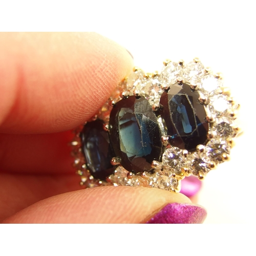 691 - An 18ct substantial sapphire and diamond ring