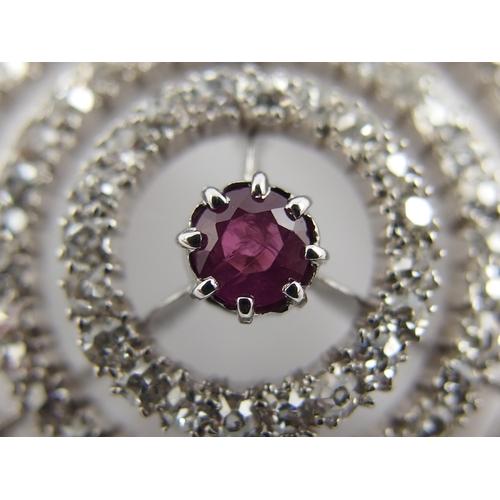 692 - A ruby and diamond pendant