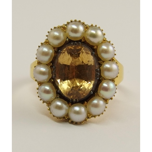 701 - A pale orange topaz and pearl ring