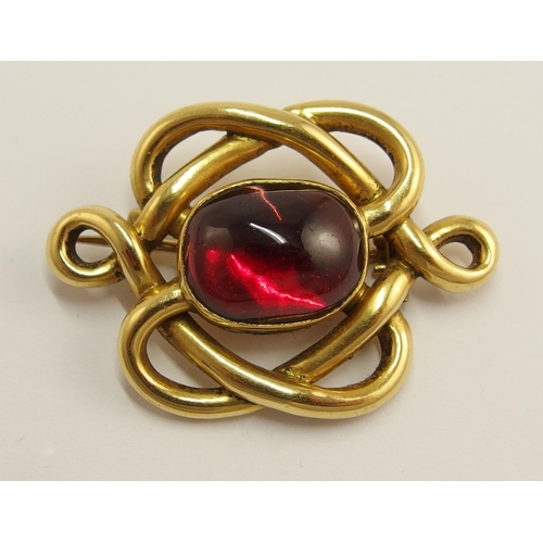 715 - A bright yellow metal knot shaped brooch