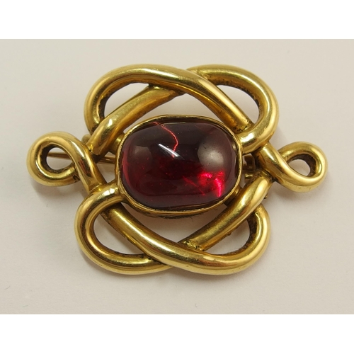 715 - A bright yellow metal knot shaped brooch