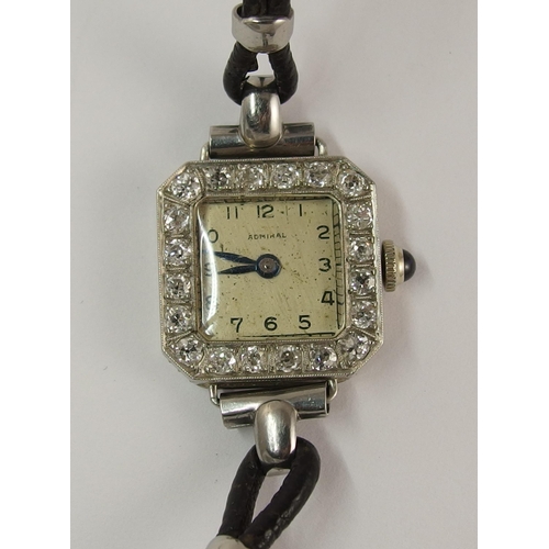 716 - A yellow and white metal diamond set cocktail watch