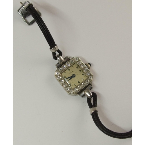 716 - A yellow and white metal diamond set cocktail watch