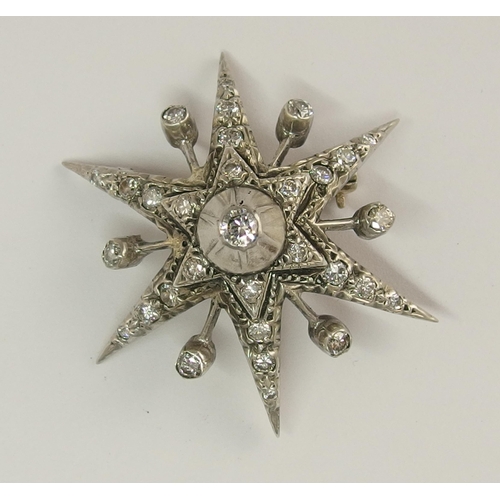 722 - A diamond set star brooch