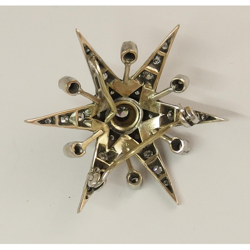 722 - A diamond set star brooch