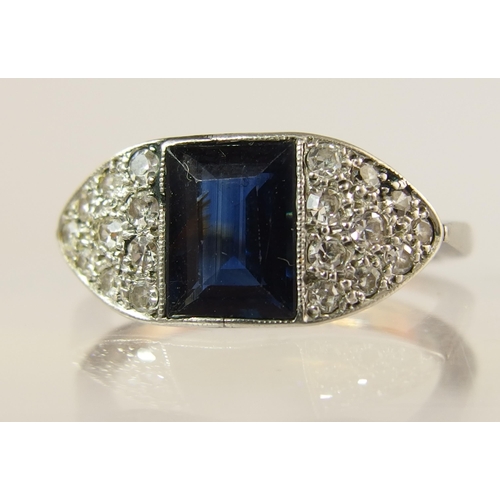 723 - An 18ct and platinum sapphire and diamond ring