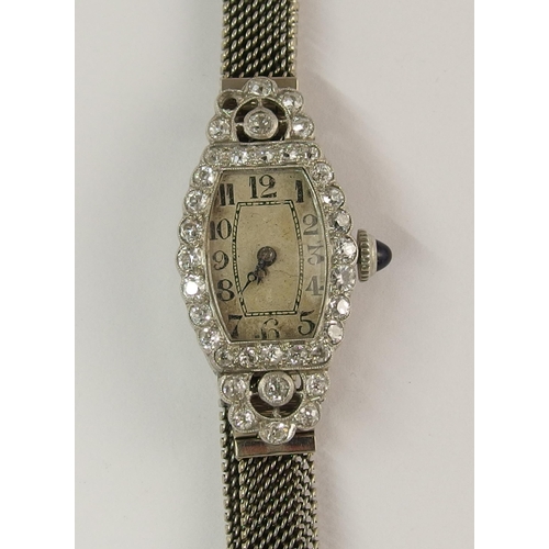 724 - A platinum and diamond cocktail watch