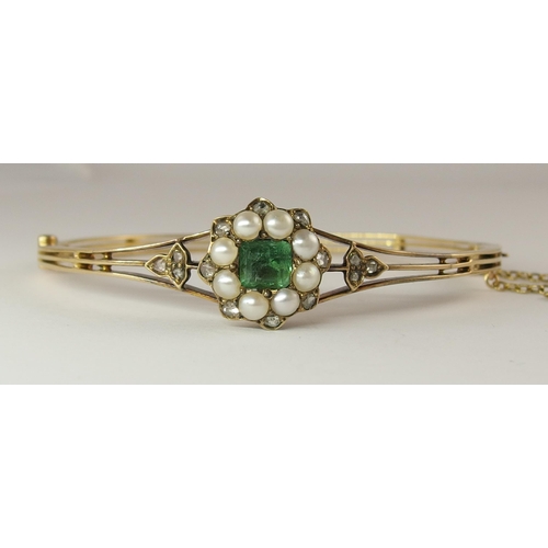 725 - An emerald  diamond and pearl vintage bangle