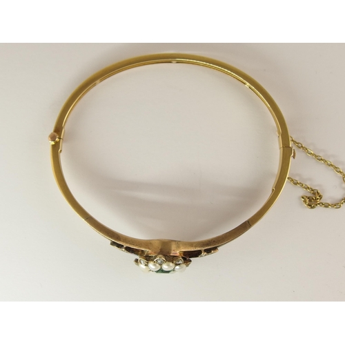 725 - An emerald  diamond and pearl vintage bangle