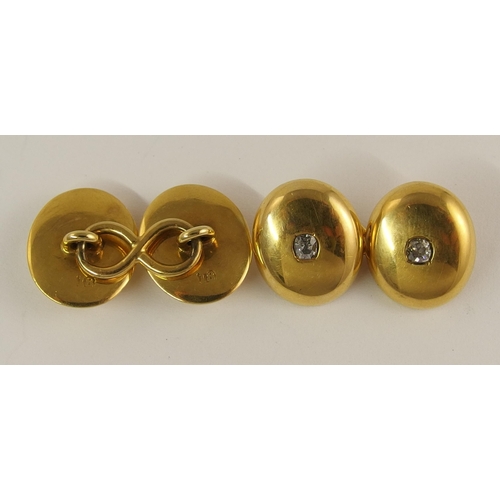 727 - A pair of 18ct gold and diamond cufflinks