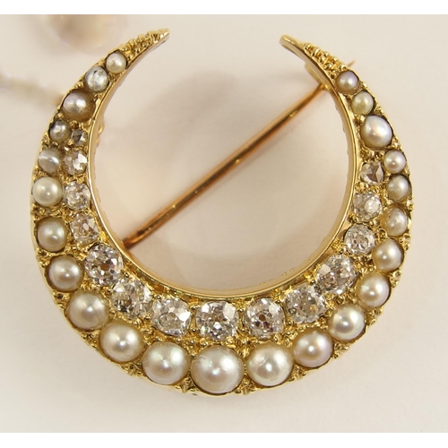 732 - A Victorian pearl and diamond crescent moon brooch