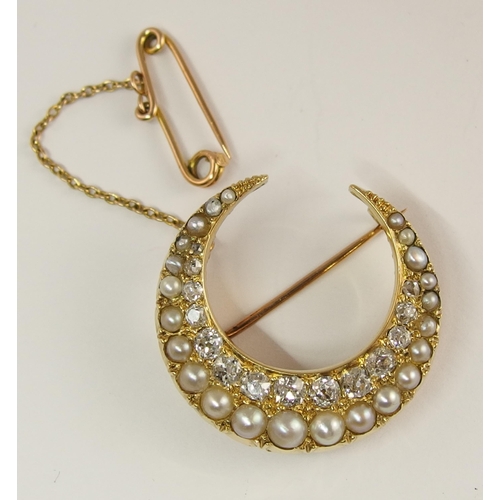 732 - A Victorian pearl and diamond crescent moon brooch