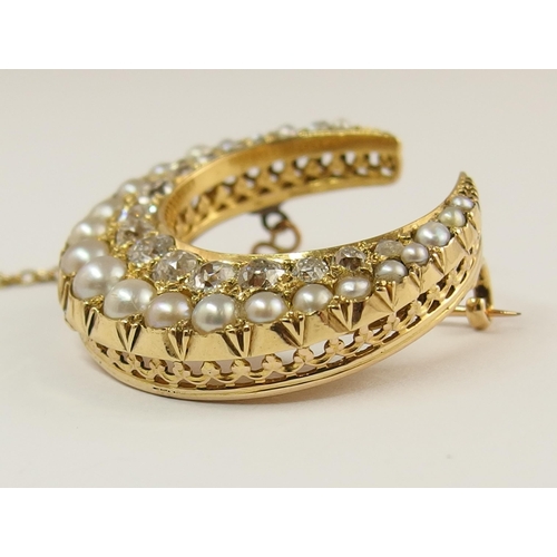 732 - A Victorian pearl and diamond crescent moon brooch