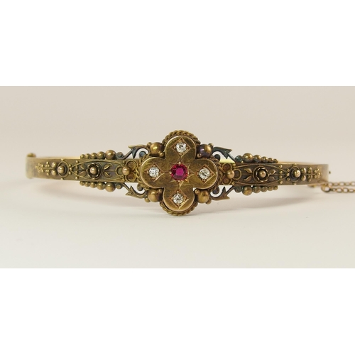 737 - An Etruscan revival bangle set with diamonds and a red gem