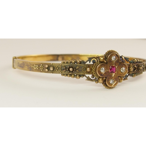 737 - An Etruscan revival bangle set with diamonds and a red gem