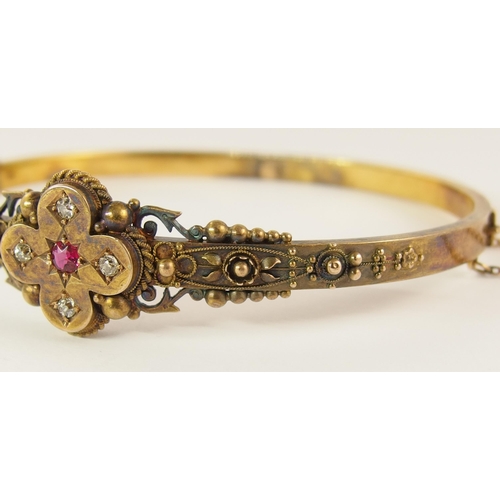 737 - An Etruscan revival bangle set with diamonds and a red gem