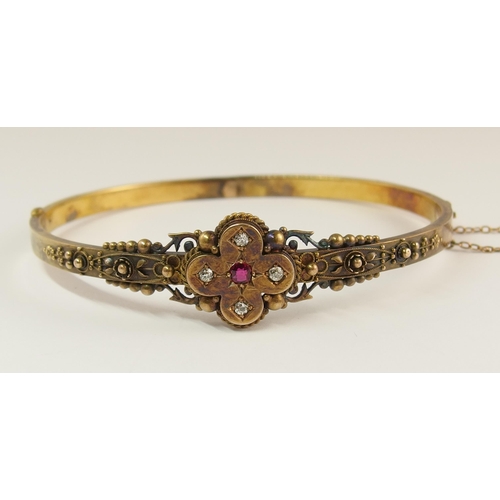 737 - An Etruscan revival bangle set with diamonds and a red gem