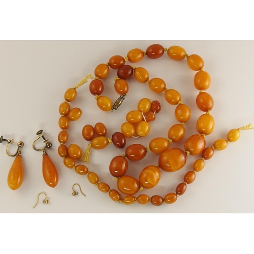 748 - Two amber coloured bead necklaces and a pair of earrings