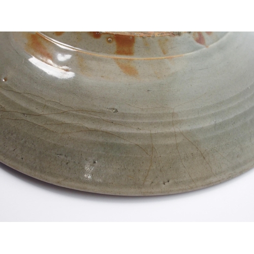 75 - A Chinese celadon saucer dish