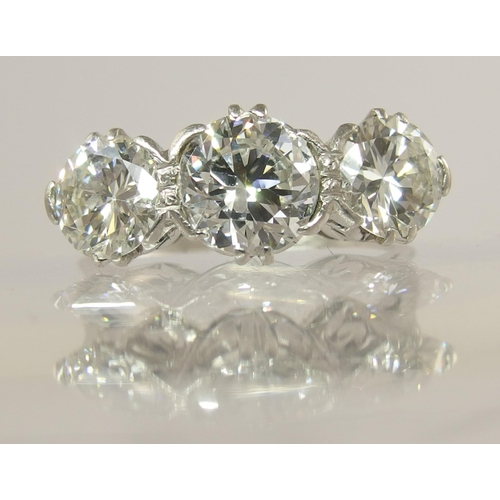 750 - A substantial three stone diamond ring