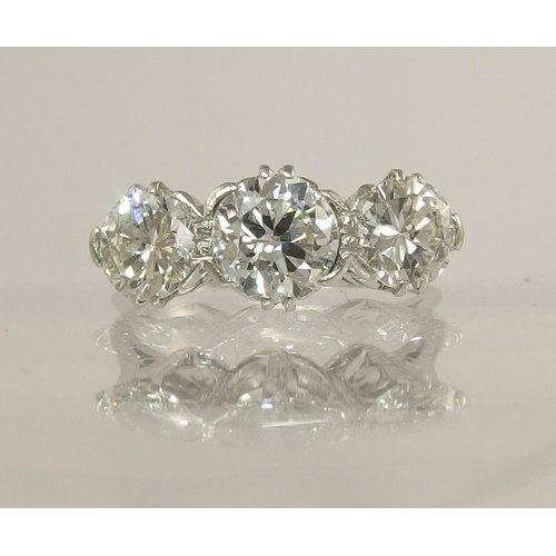 750 - A substantial three stone diamond ring