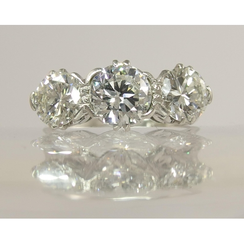 750 - A substantial three stone diamond ring