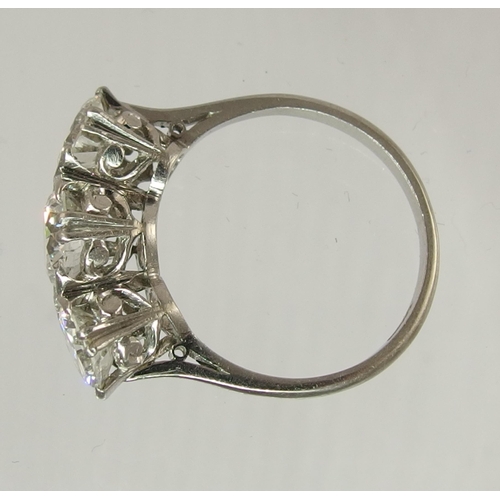 750 - A substantial three stone diamond ring