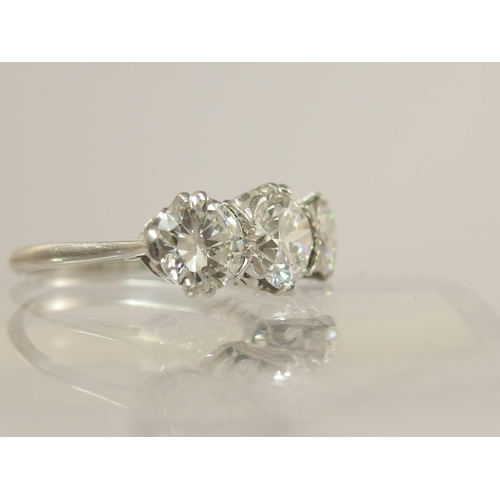 750 - A substantial three stone diamond ring