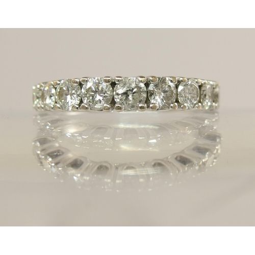 751 - A white metal diamond set eternity ring