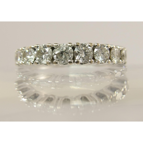 751 - A white metal diamond set eternity ring