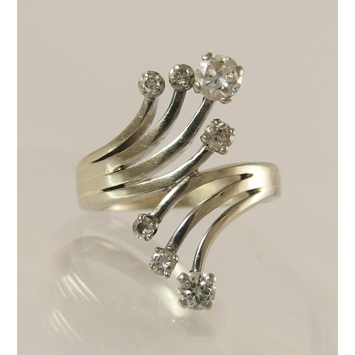 757 - A seven diamond spray style cluster ring