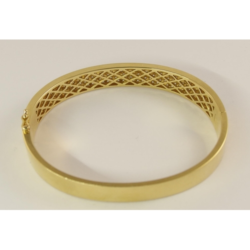 758 - An 18ct yellow gold diamond set bangle