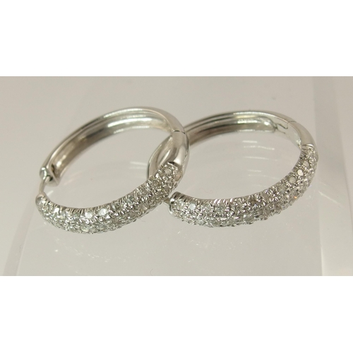 759 - A pair of 9ct white gold diamond pave set earrings