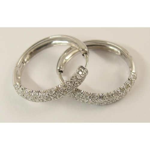 759 - A pair of 9ct white gold diamond pave set earrings