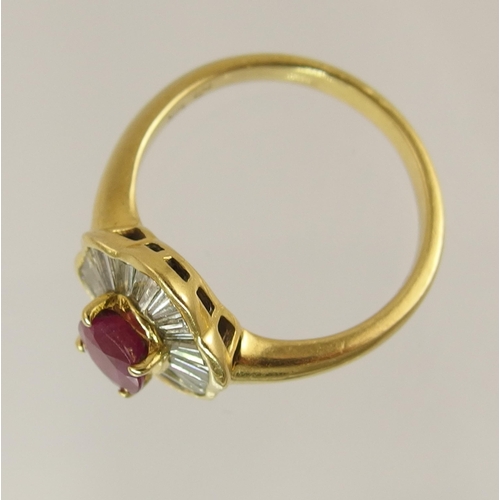 760 - An 18ct yellow gold diamond and ruby cluster ring