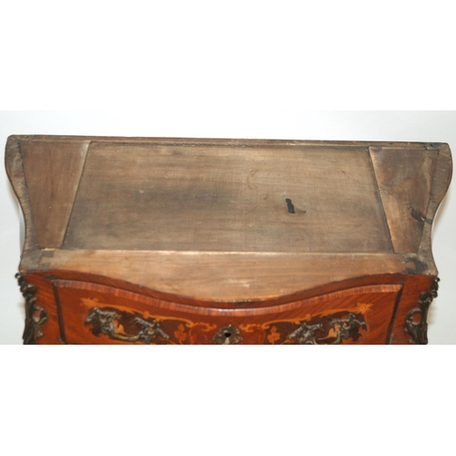 803 - A Louis XV style rosewood serpentine shaped commode