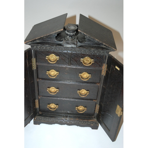 804 - A Victorian ebonised oak miniature cabinet