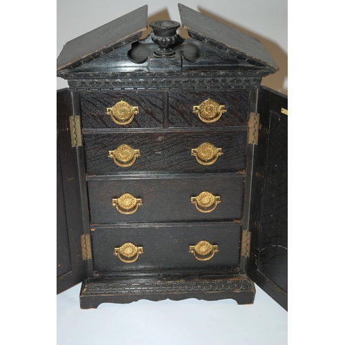 804 - A Victorian ebonised oak miniature cabinet