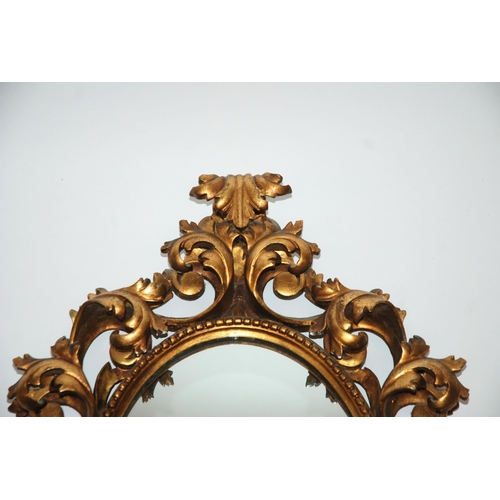 819 - An Italian giltwood wall mirror