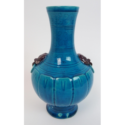 104 - A Chinese archaic style blue ground vase