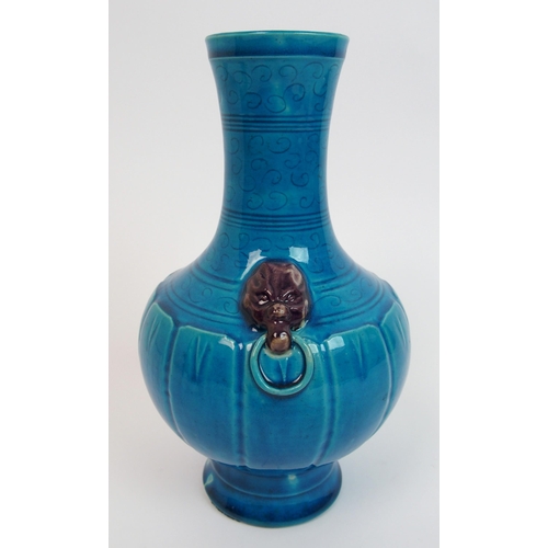 104 - A Chinese archaic style blue ground vase