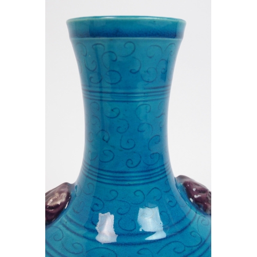 104 - A Chinese archaic style blue ground vase