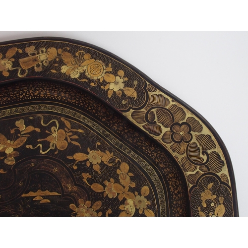 111 - A Chinese export black and gold lacquered tea tray