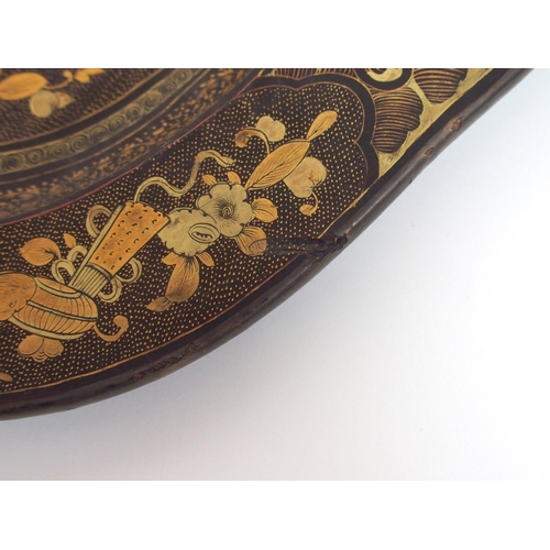 111 - A Chinese export black and gold lacquered tea tray