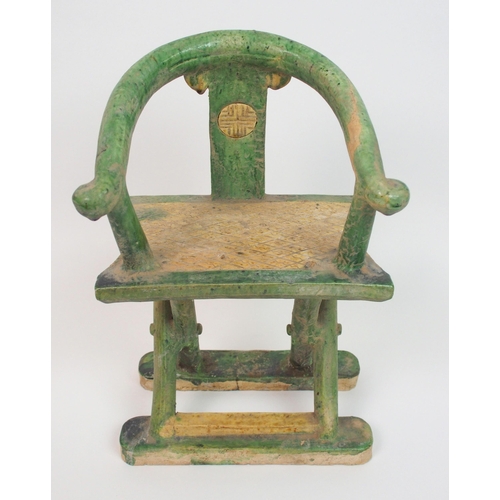 113 - A Tang style horseshoe back armchair