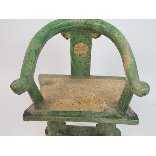 113 - A Tang style horseshoe back armchair