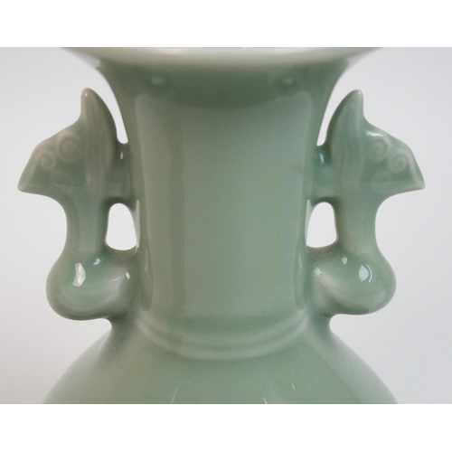 119 - A pair of Chinese celadon ground two-handled baluster vases